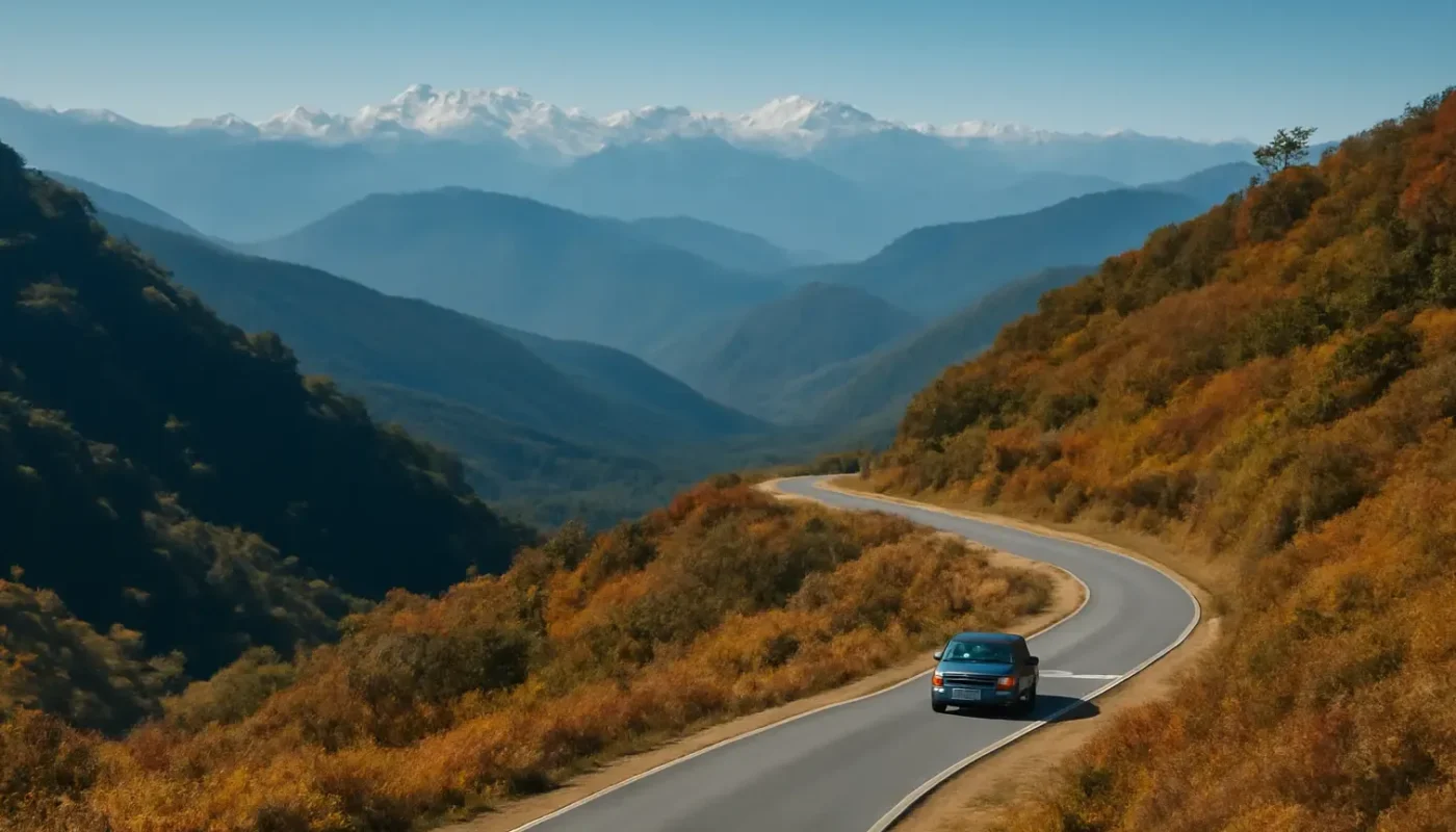 Winding mountain road through Arunachal Pradesh valleys in autumn light
